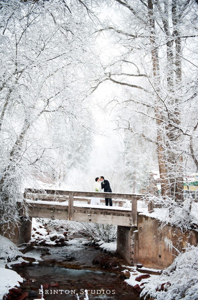 Wedding romance on a bridge during a winter wedding photo Brintonstudios.com
